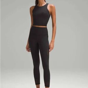 Lululemon wonder train mesh panel HR tight 25 inch. Color black size 12.